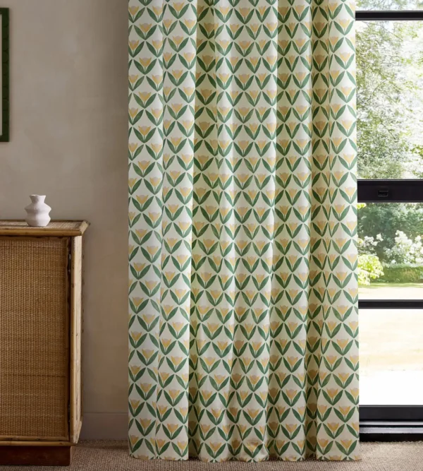 green botanical curtain with cabinets and window