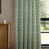 green botanical curtain with cabinets and window