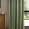 green geometric curtain with cabinets and window