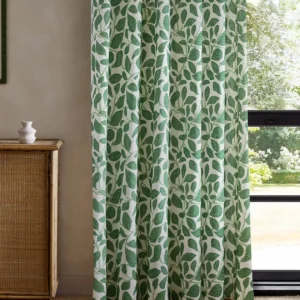 green botanical curtain with cabinets and window