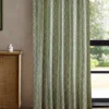 green striped curtain with cabinets and window