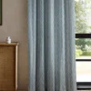 blue striped curtain with cabinets and window