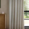 neutral striped curtain with cabinets and window