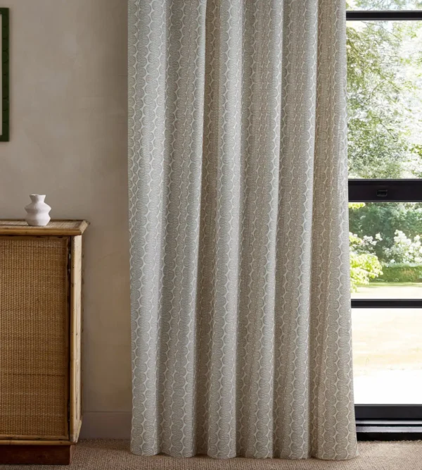 neutral striped curtain with cabinets and window