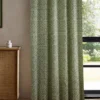 green striped curtain with cabinets and window