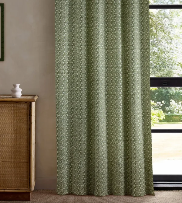 green striped curtain with cabinets and window