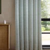 blue striped curtain with cabinets and window