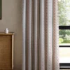 pink striped curtain with cabinets and window