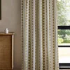 green striped curtain with cabinets and window