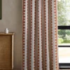 red striped curtain with cabinets and window