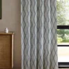 blue geometric curtain with cabinets and window