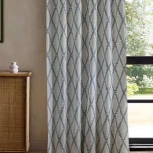 blue geometric curtain with cabinets and window