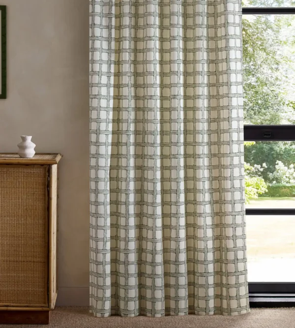 green checked curtain with cabinets and window