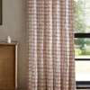 red checked curtain with cabinets and window