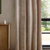 orange botanical curtain with cabinets and window