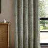 green botanical curtain with cabinets and window