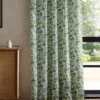 green botanical curtain with cabinets and window
