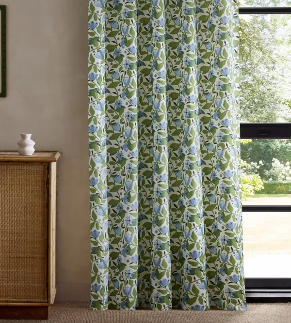 green botanical curtain with cabinets and window