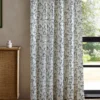 blue animal curtain with cabinets and window