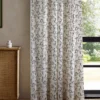 brown animal curtain with cabinets and window