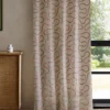 orange misc curtain with cabinets and window