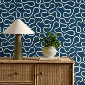 blue misc wallpaper and wall with cabinets and vases