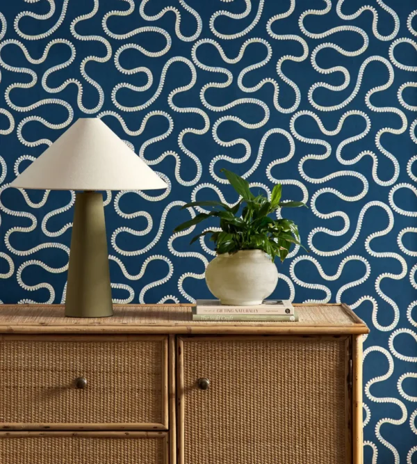 blue misc wallpaper and wall with cabinets and vases