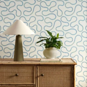 blue misc wallpaper and wall with cabinets and vases