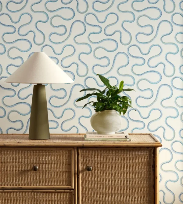 blue misc wallpaper and wall with cabinets and vases