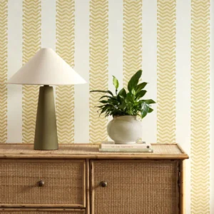 yellow striped wallpaper and wall with cabinets and vases