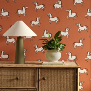 orange animal wallpaper and wall with cabinets and vases