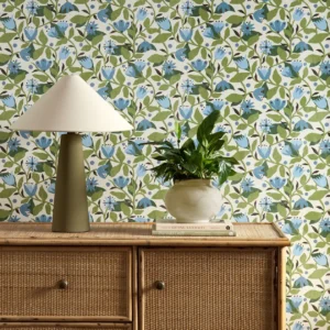 blue botanical wallpaper and wall with cabinets and vases