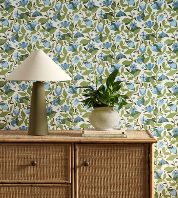 Dancing Daisies Wallpaper - Cornflower by blue botanical wallpaper and wall with cabinets and vases