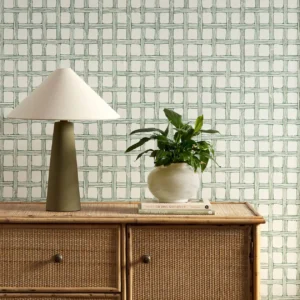 green checked wallpaper and wall with cabinets and vases