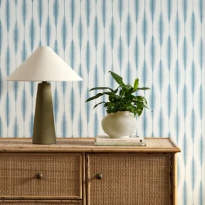 blue striped wallpaper and wall with cabinets and vases