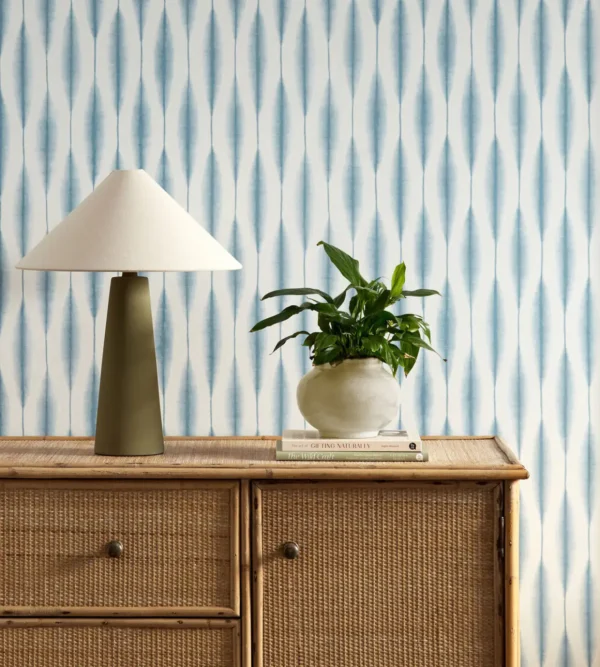 Kasuri Wallpaper - Coast Blue by blue striped wallpaper and wall with cabinets and vases