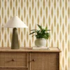yellow striped wallpaper and wall with cabinets and vases