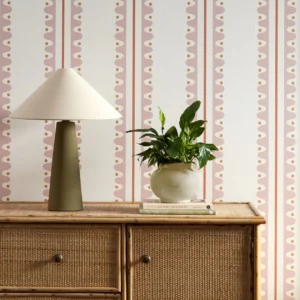 pink striped wallpaper and wall with cabinets and vases