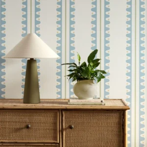 blue striped wallpaper and wall with cabinets and vases