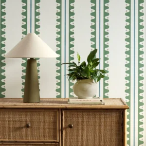green striped wallpaper and wall with cabinets and vases