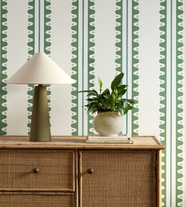 Oakham Wallpaper - Forest by green striped wallpaper and wall with cabinets and vases