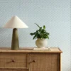 blue striped wallpaper and wall with cabinets and vases