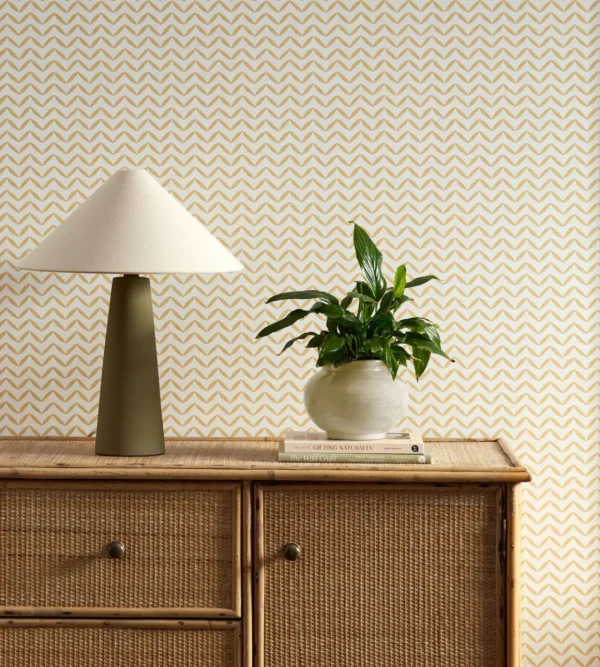 yellow misc wallpaper and wall with cabinets and vases