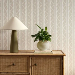 neutral striped wallpaper and wall with cabinets and vases