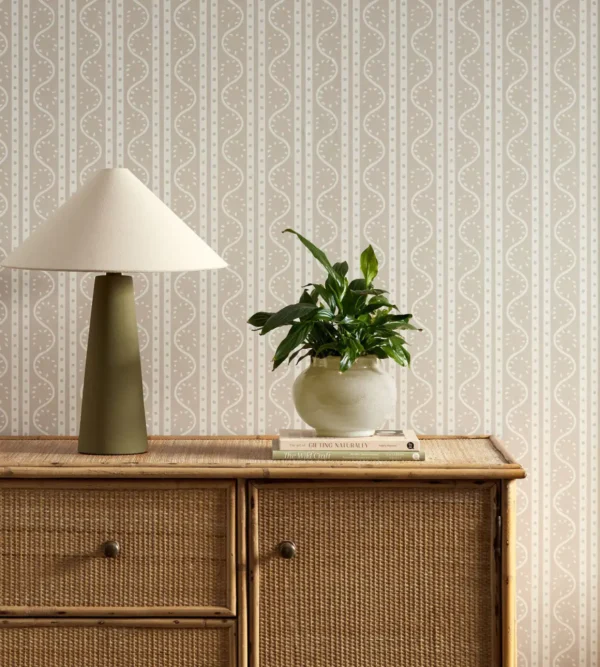 neutral striped wallpaper and wall with cabinets and vases