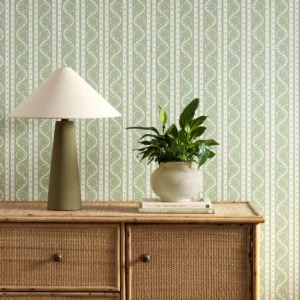 green striped wallpaper and wall with cabinets and vases