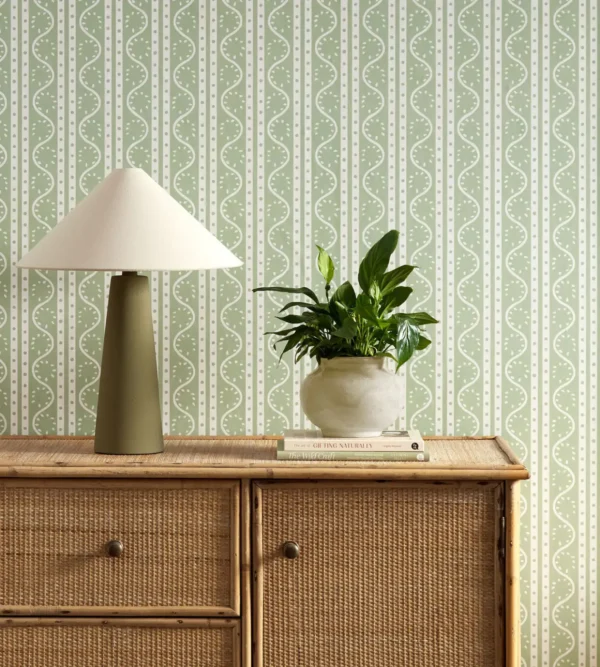 Split Pea Wallpaper - Sage by green striped wallpaper and wall with cabinets and vases