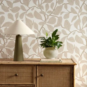 neutral botanical wallpaper and wall with cabinets and vases