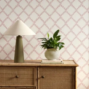 pink geometric wallpaper and wall with cabinets and vases