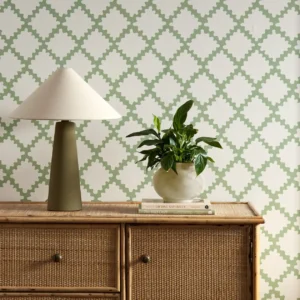 green geometric wallpaper and wall with cabinets and vases